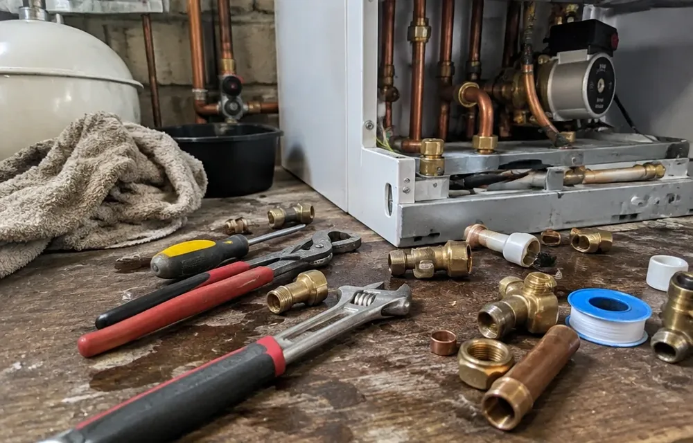 Close-up detail of boiler installation and servicing parts and tools